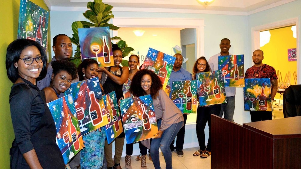 Show item 4 of 5. Large group at the Paint and Sip Party in Nassau