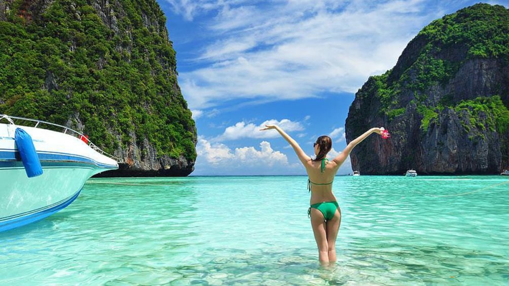 woman enjoying the beach waters in Thailand