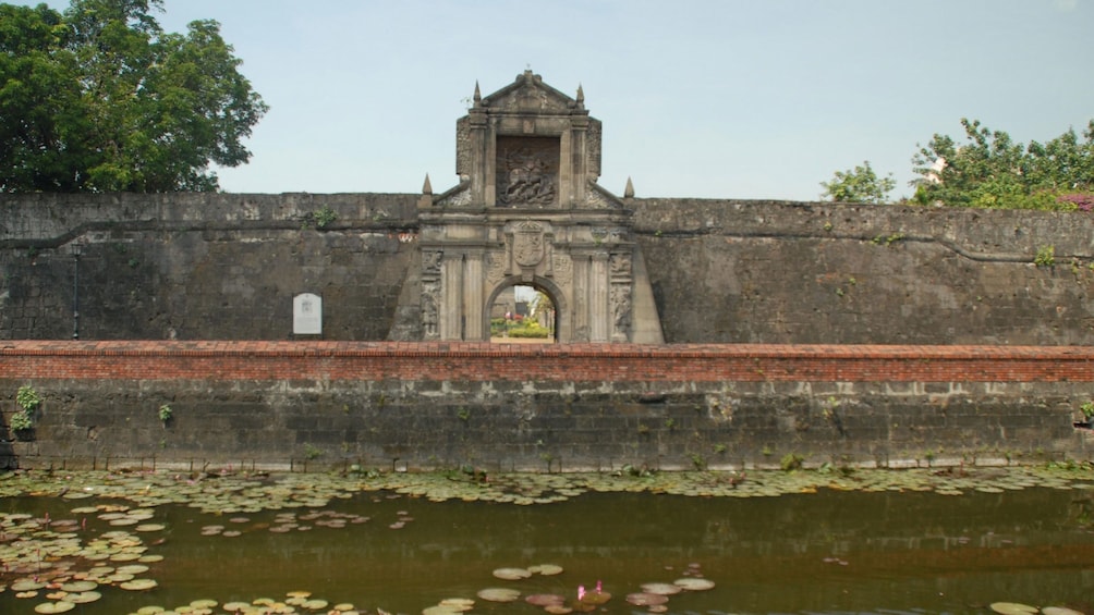 Stone building next to river in Manila