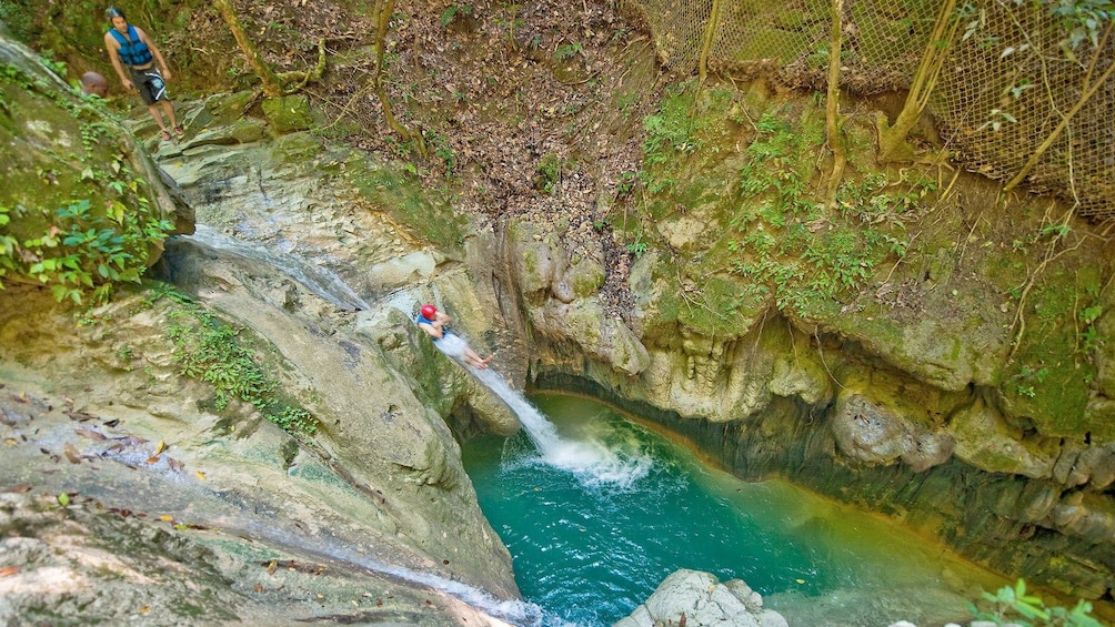 Tourist jumping into the Damajagua Waterfalls
