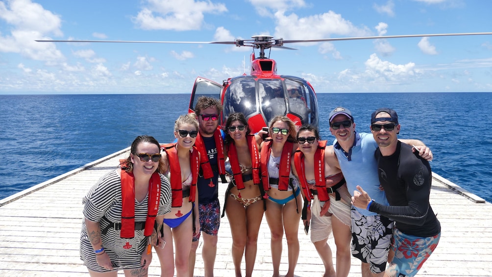 People on dock with helicopter