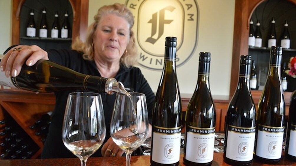 Show item 1 of 5. woman pouring wine