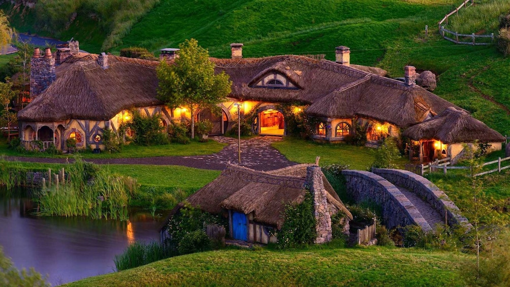 Hobbiton houses and pond at night