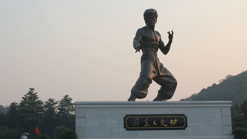 Show item 1 of 6. Statue of Bruce Lee on the Kungfu Tour in Bruce Lees Hometown