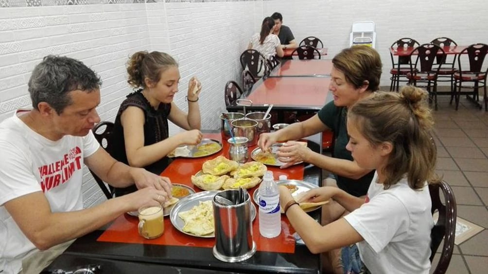 Family eating at a restaurant in Malaysia