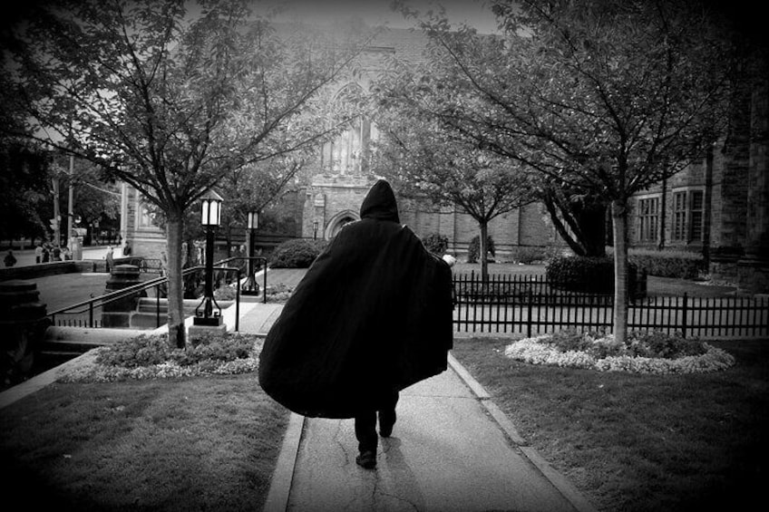 A cloaked tour guide
