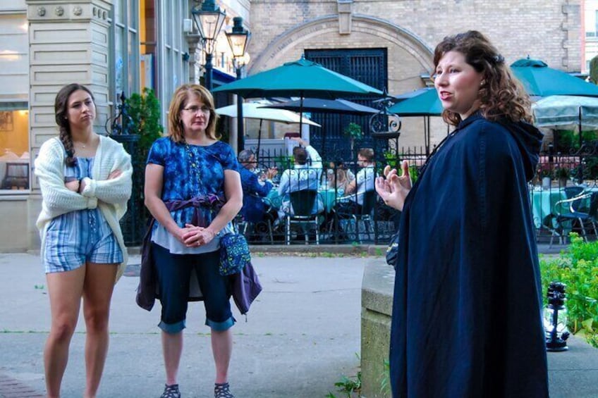 Tour guide sharing a spooky tale