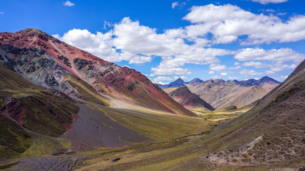 Rolling green foothills of Rainbow Mountain in Lima