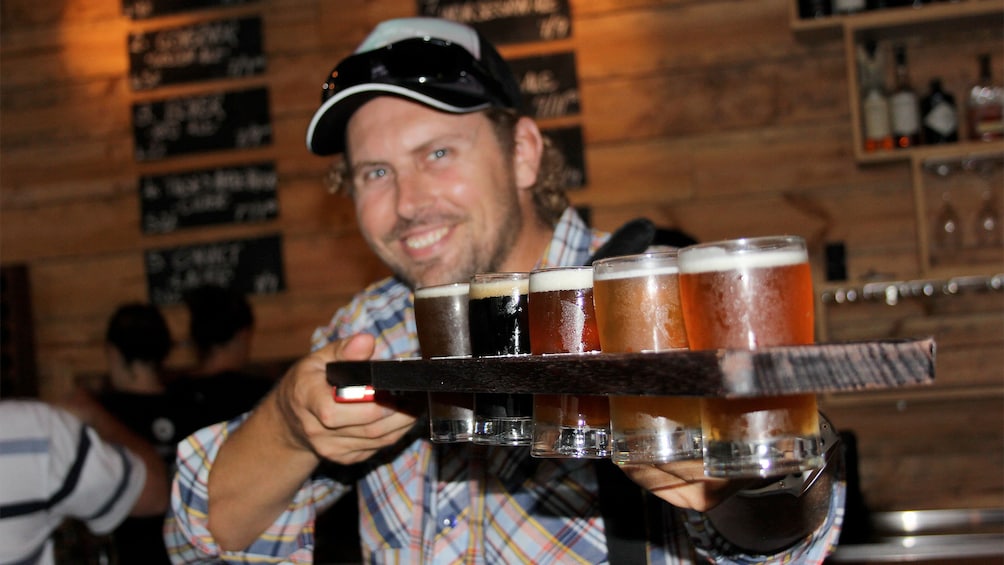 Man carrying beers at the Craft Beer Tour in Sydney 