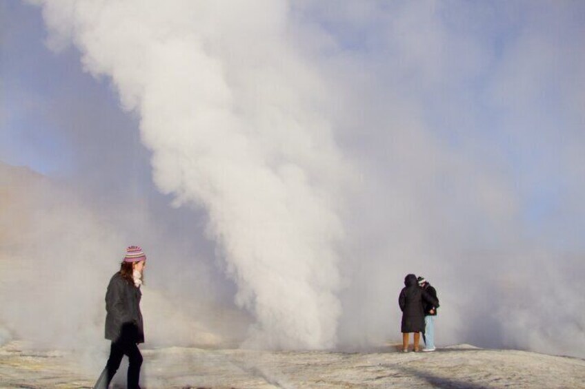 Visitors enjoying the geysers of Sol de mañana volcano