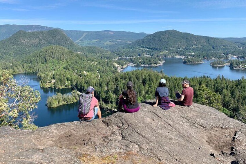 Four armigos are enjoying the stunning view of Pender Harbour. 