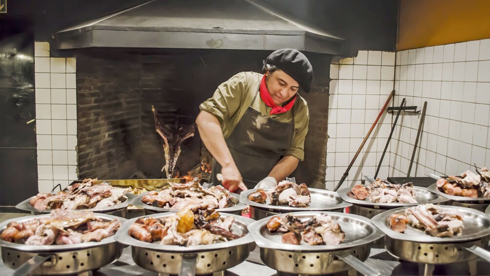 Cook preparing food on the 25 de Mayo Ranch Tour in Argentina