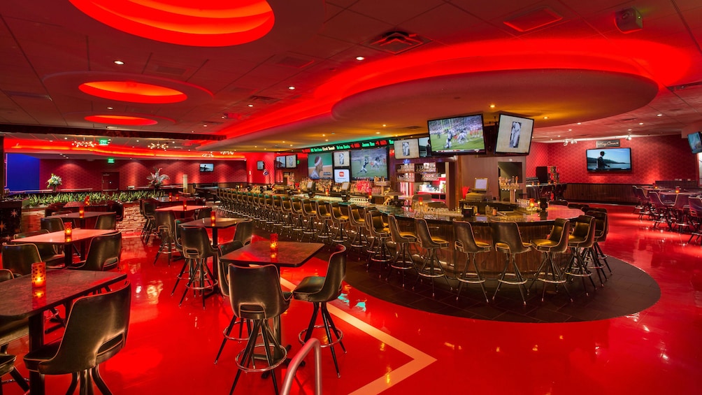 Retro-style bar with red lighting at Kings Bowl in Orlando