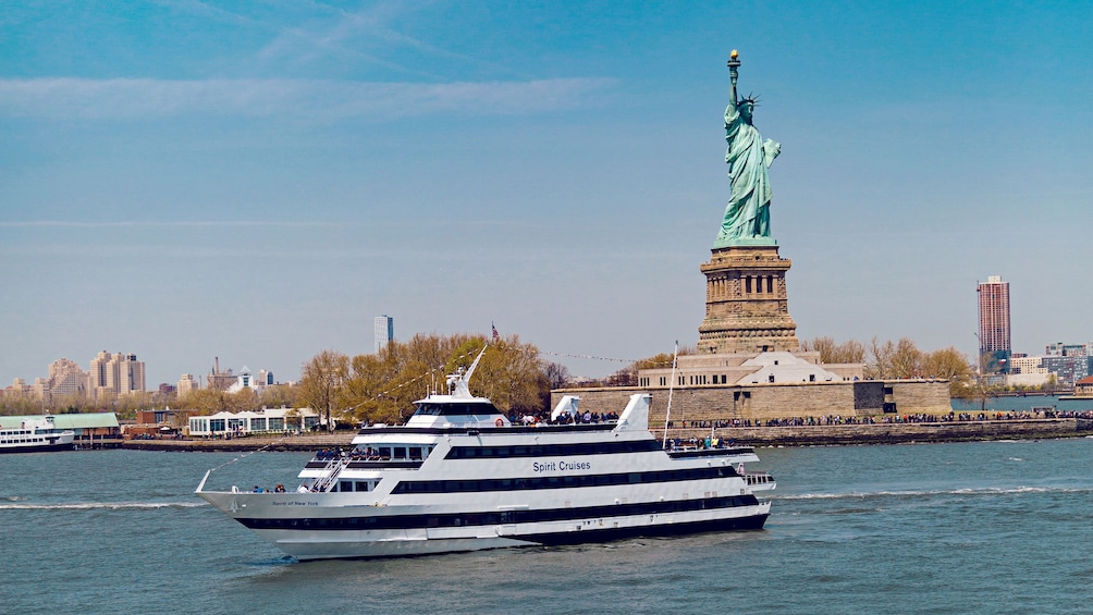 Tour boat passing the Statue of Liberty in New York