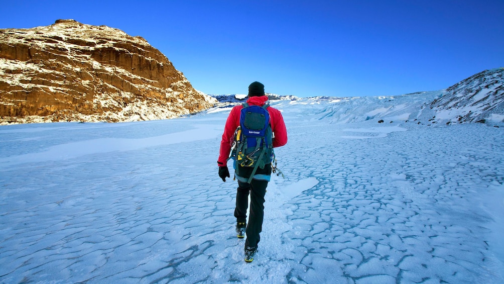 Man walks across an Iceberg