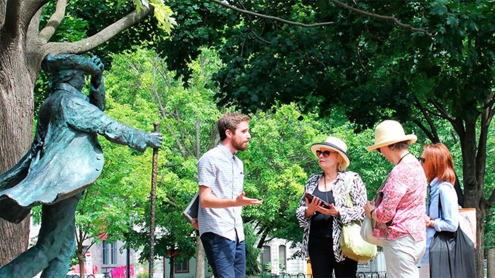 Apri foto 2 di 5. Group looking at sculptures outside the Musee McCord in Montreal