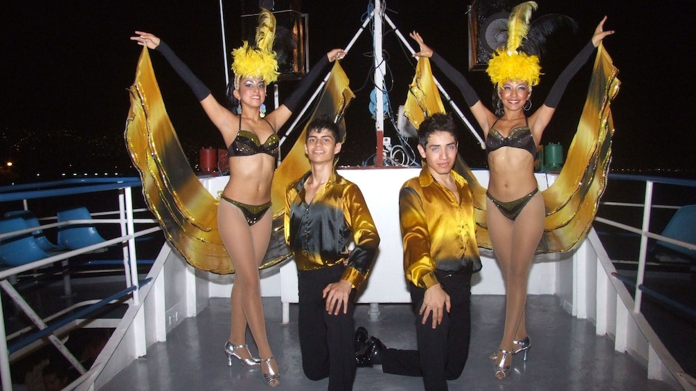 Costumed dancers on a boat in Mexico