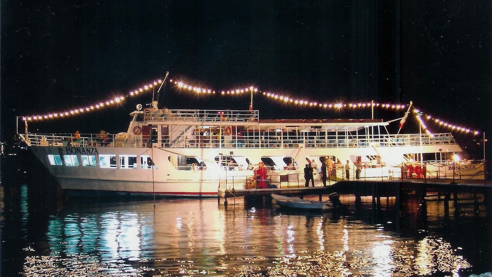 Boat lit up at night in Mexico