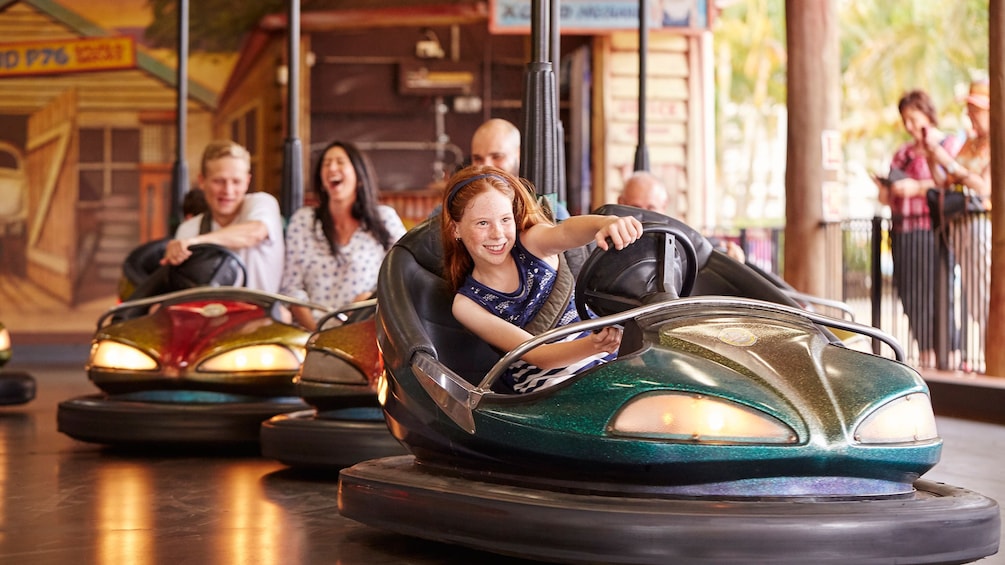 Show item 5 of 10. People riding bumper cars at Aussie World