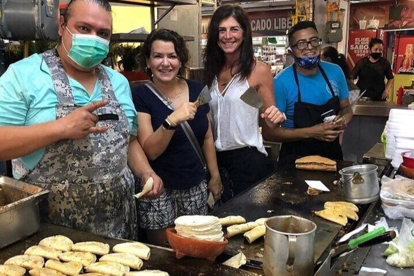 Taking a photo with the taco artists.