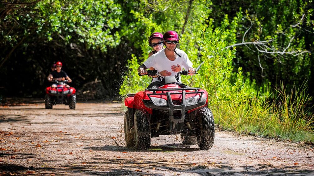 Two ATVS on a trail in Cancun