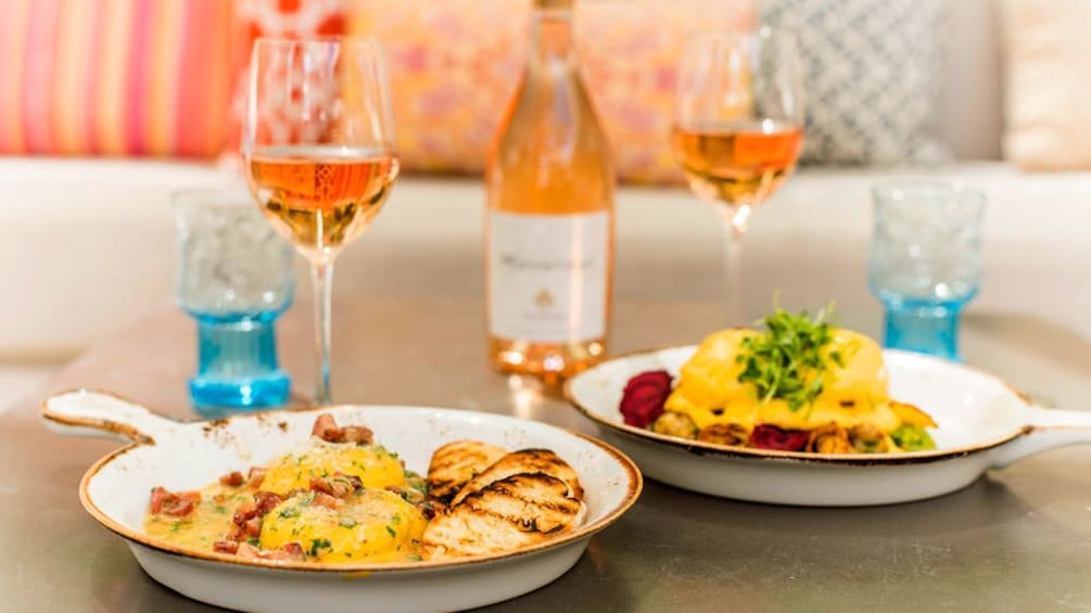 Pink champagne brunch  with food in skillets