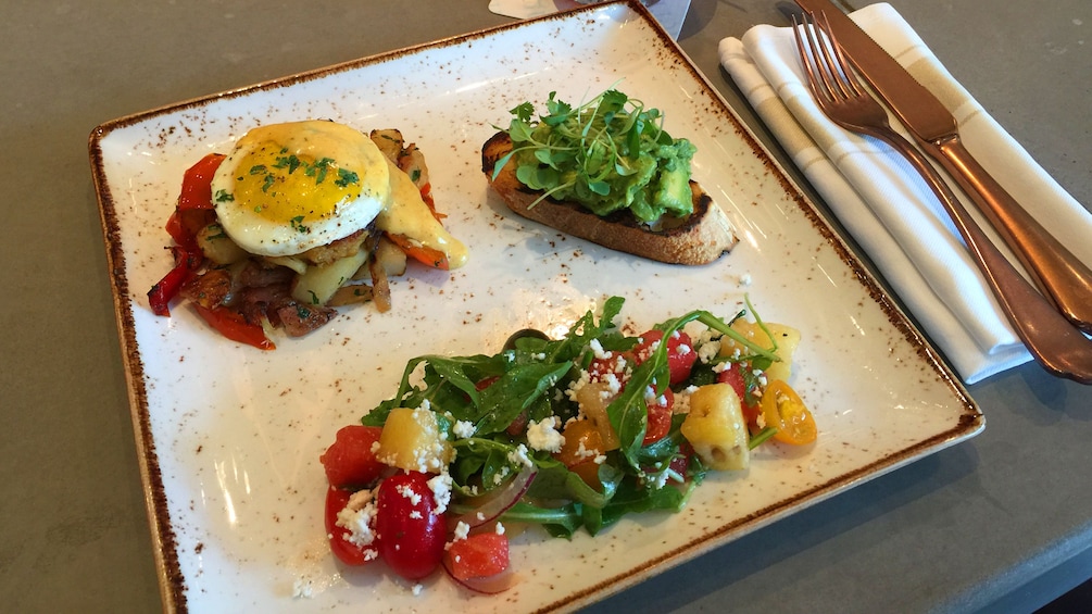 A trio of food for bunch on a square plate