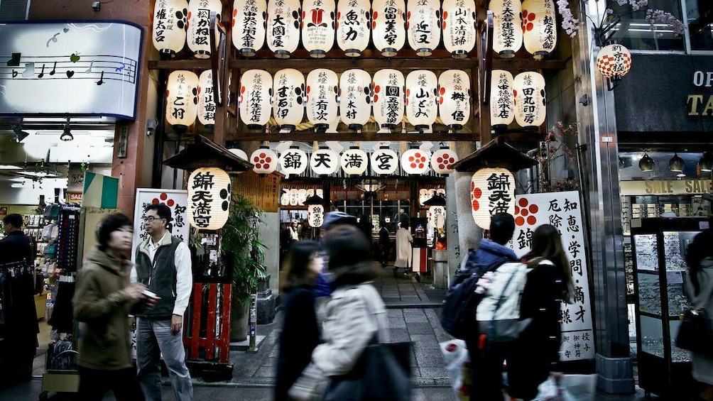 Show item 3 of 5. Lanterns on a crowded Japanese street
