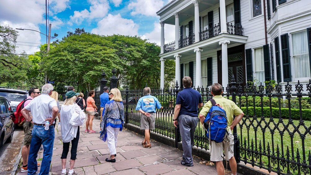 Tour group in front of historic mansion in New Orleans