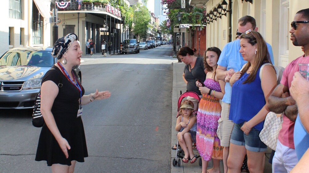 Tour guide talking to group on the street in New Orleans