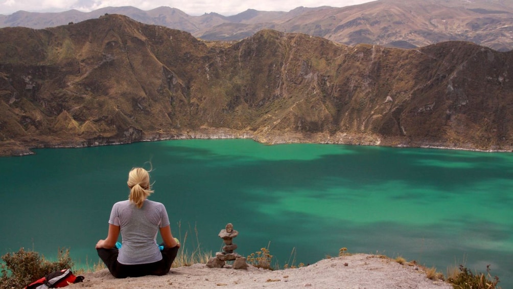Woman enjoying the view of Quilotoa Lagoon in Quito