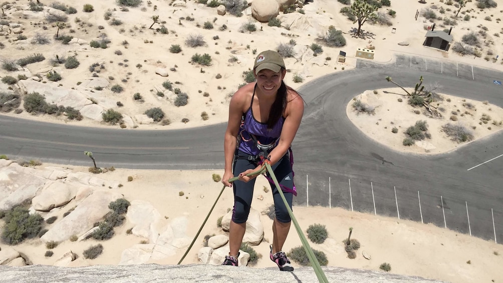 Show item 4 of 4. Woman on the Rappelling Adventure at Joshua Tree