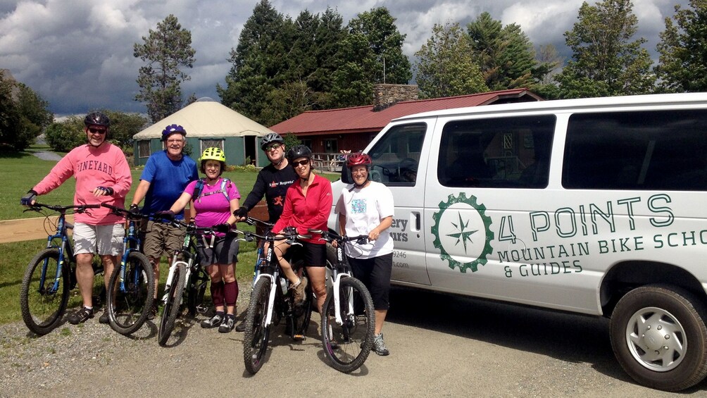 Bicycling group and van in Vermont