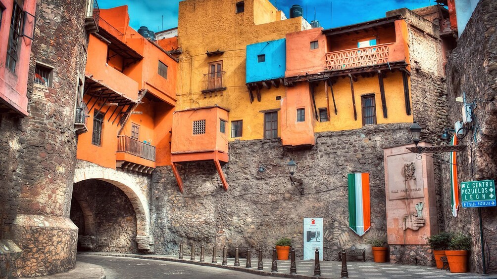 Colorful buildings lining the street in Guanajuato