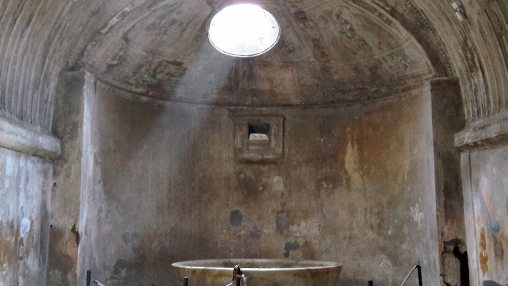 Light streaming through a ceiling in the ruins of Pompeii