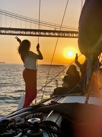The Lisbon Sunset Sailing Experience with a drink