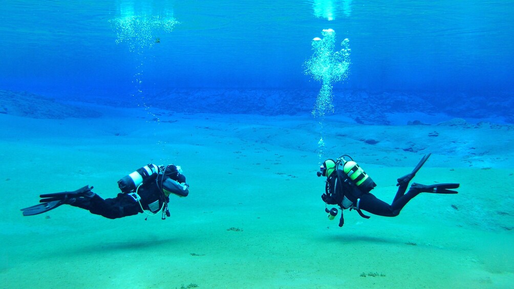 Pair of scuba divers in Reykjavik