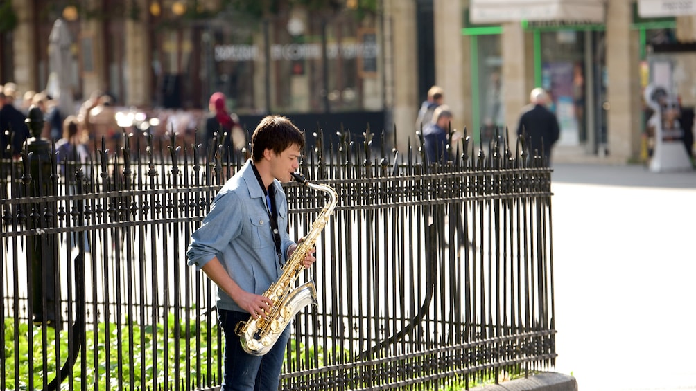 Man playing a saxophone on the street in Bordeaux