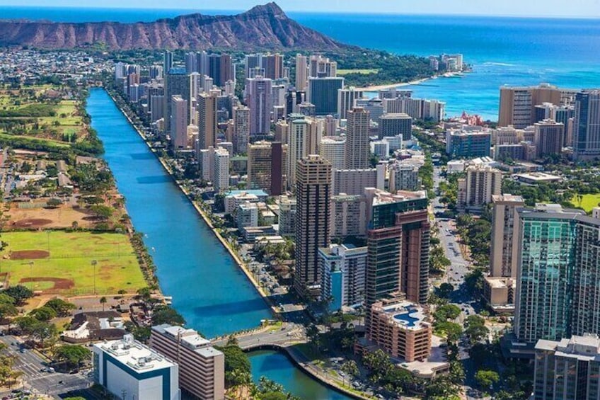 Travel along the calm waters of Waikiki's Canal with spectacular views of Diamond Head.