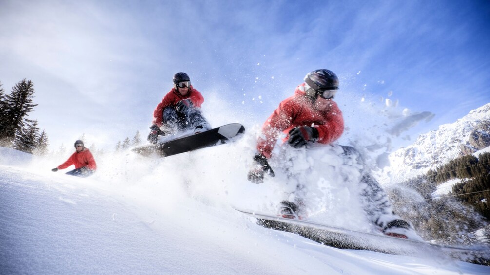 Snowboarder jumping off a hill