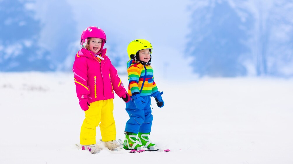 Two children skiing