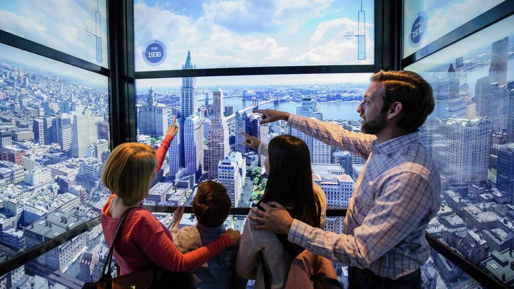 Family looking at interactive at One World Observatory in New York