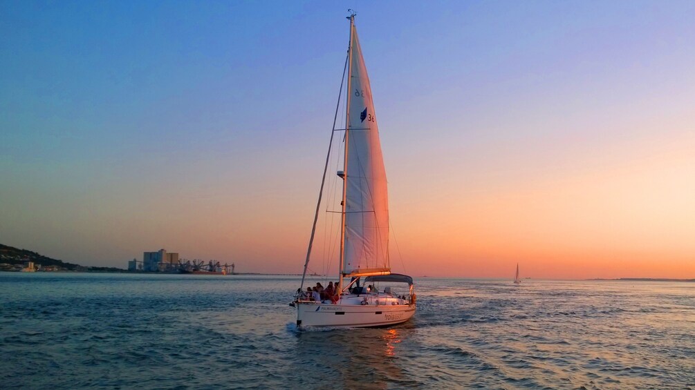 Sailboat at sunset in Lisbon