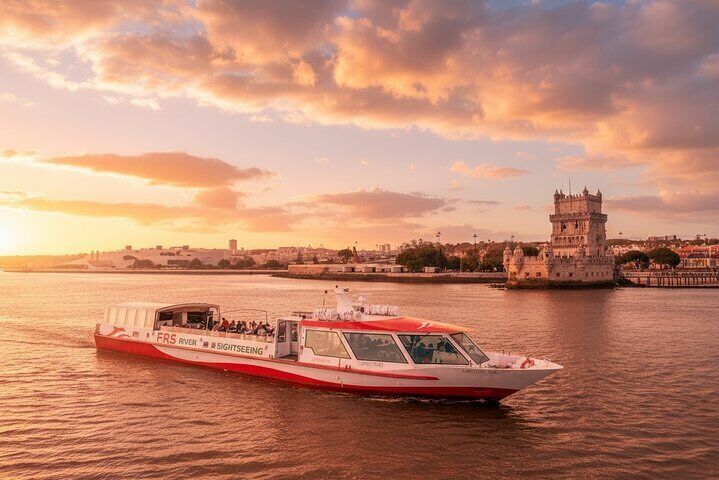 Panorama boat MS "Hanseblick" in front of Belém Tower during the sunset cruise.