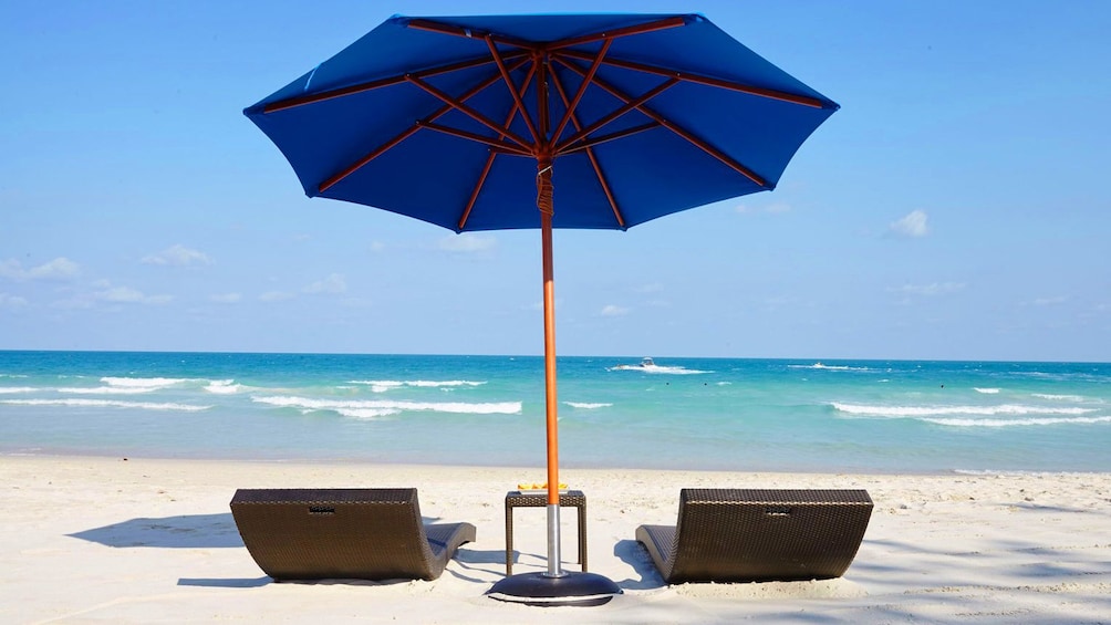 Two chairs on a beach 