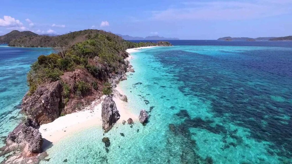 Picture 1 for Activity Coron: Coastal Cliffs, Beach & Malcapuya Island Hopping Tour