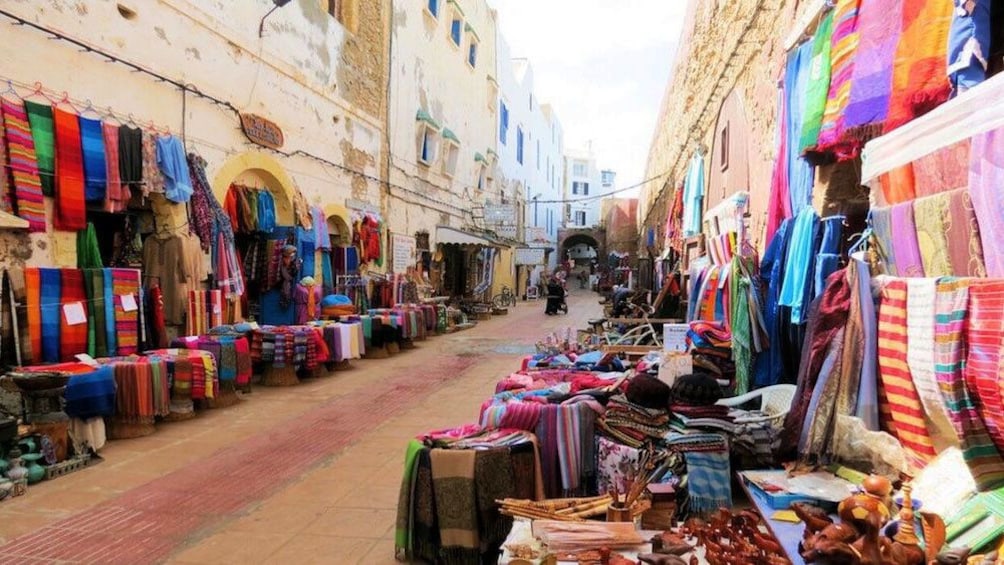 Fabric vendors along the street in Essaouira