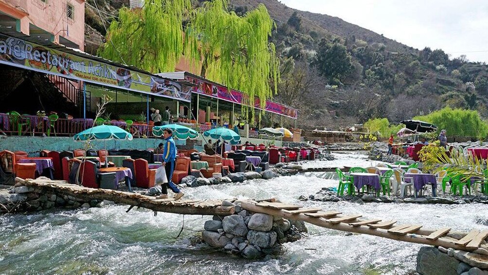 Restaurant with seating spanning the river in Ourika Valley