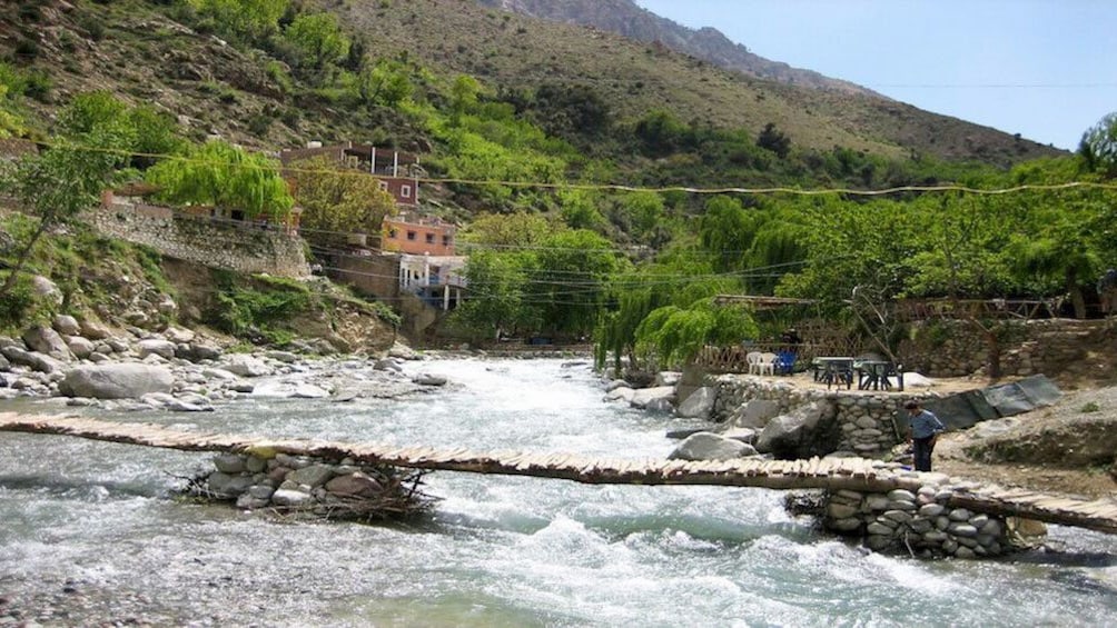 Foot bridge spanning river in Ourika Valley