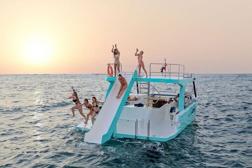 Slide, Cruise & Party on JUMP Private Yacht with BBQ & Drinks